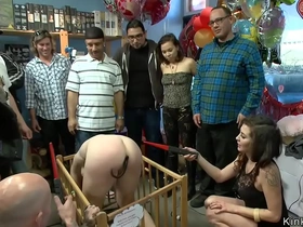 Bizarre public BDSM scene with punished slaves