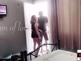 A shy girl playfully flirts with the delivery man in public