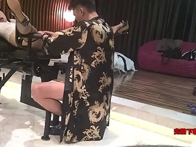 A male yoga instructor from Guangdong province engages in sexual activity with a black woman of exceptional beauty featuring large legs on a cock-shaped chair