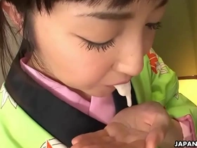 A sweet Asian beauty in a kimono gives a satisfying blowjob to her lucky partner